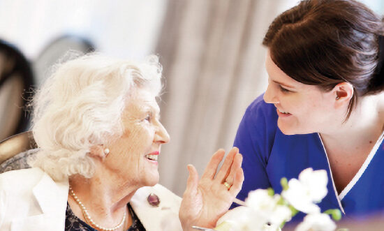 Resident with her carer