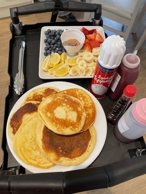 pancakes and fruit on table