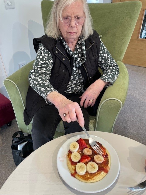 osprey resident with fork and pancake
